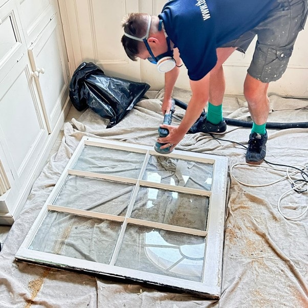 Sash Window Man craftsman sanding a window sash on site